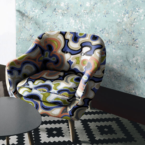 The Oh Canada collection of textile and wallcovering designs. Current on chair and Splash on wall.