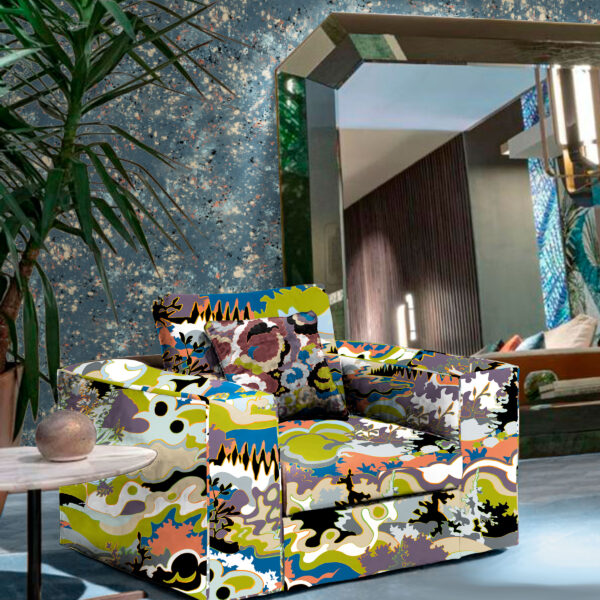 The Oh Canada textile and wallcovering collection. Taylor Head on chair, Splash on wall, and Lichen on pillow.
