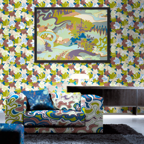 Oh Canada textile and wallcovering collection. Current on chair, Splash on pillow and ottoman, Maple on wall, Taylor Head in picture frame.