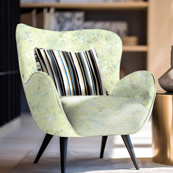 Designs from the Oh Canada textile and wallcovering collection. Splash on chair and 49 on pillow.