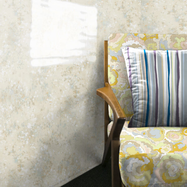 Designs from the Oh Canada textile and wallcovering collection. Lichen on chair, 49 on pillow, and Splash on wall.